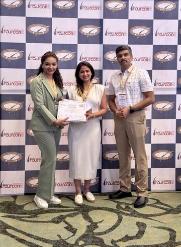 Dr. Sonia receiving a certificate at the HAIRCON 2024 hair restoration conference