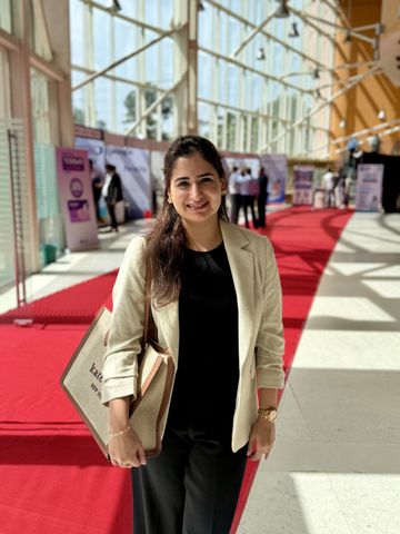 Dr. Sonia at a medical conference exhibition centre