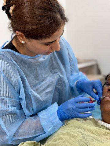 Dr. Sonia performing an injectable treatment on a patient