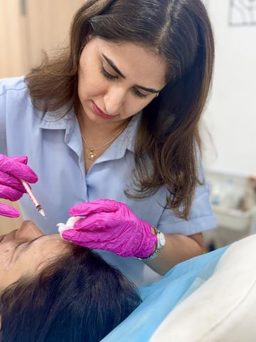 Dermatologist performing a scalp injection treatment for hair restoration